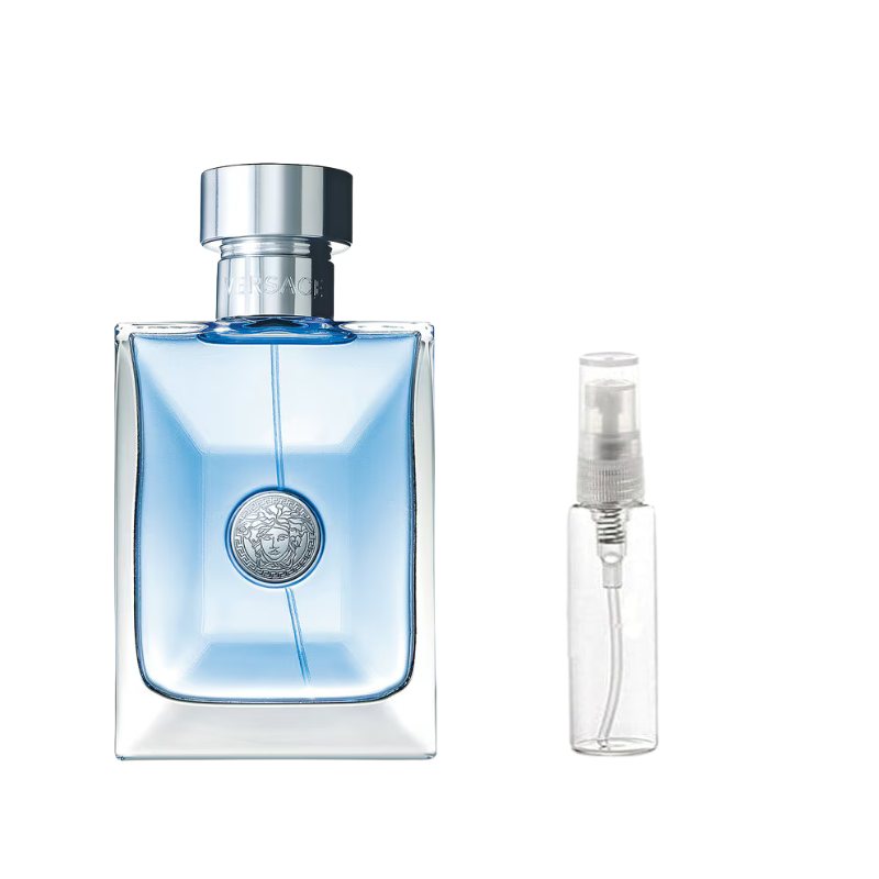 Blue glass perfume bottle with silver cap, shown with clear travel spray vial