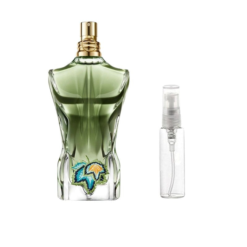 Green perfume bottle sample with gold cap and clear travel spray vial
