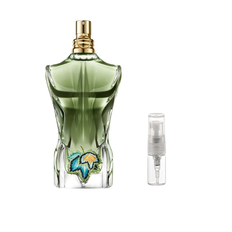 Green perfume bottle sample with gold cap and small clear travel spray vial