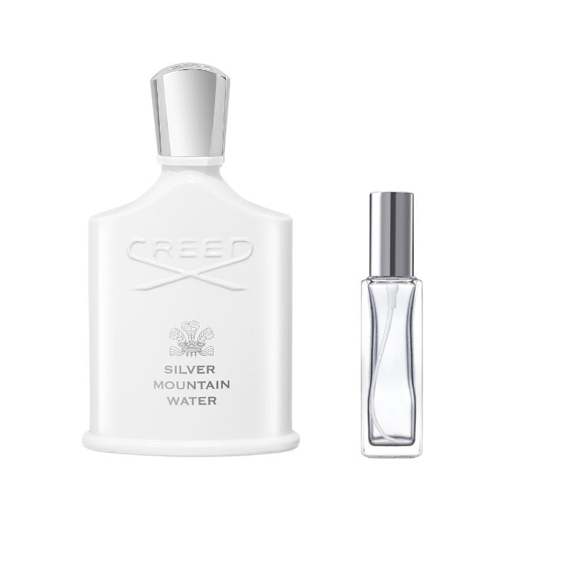 Clear perfume sample bottle with silver cap and angled label panel
