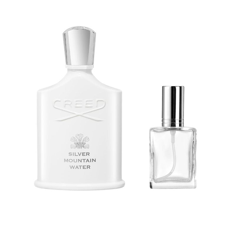 Clear glass perfume sample bottle with silver cap, front label panel