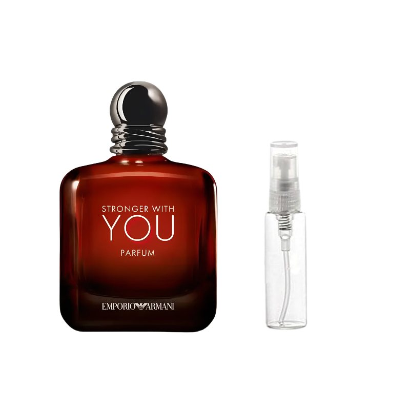 Amber-brown perfume bottle with black cap beside clear spray sample vial