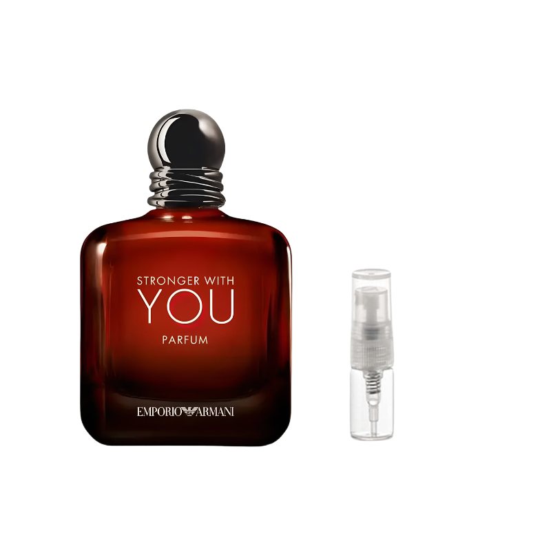 Amber-brown perfume bottle with black cap beside clear 2 ml spray vial