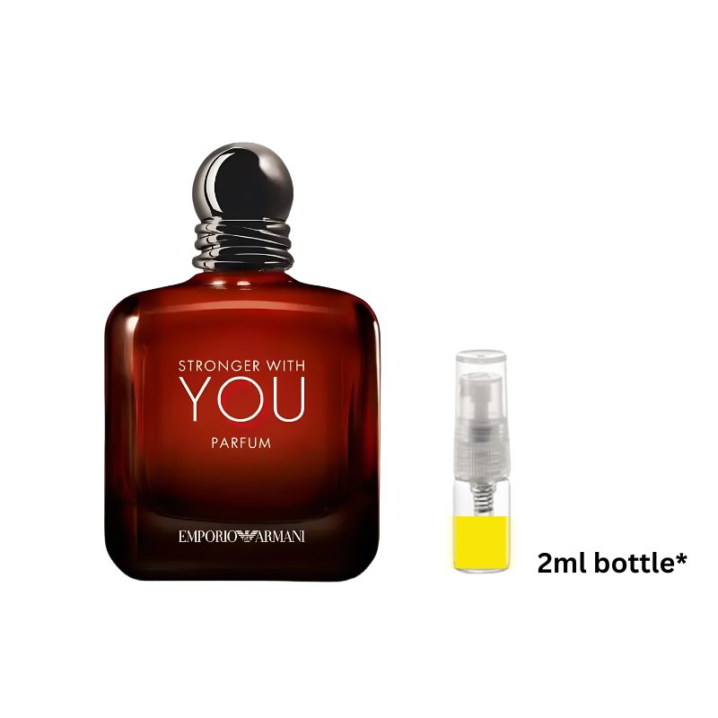 Amber-brown perfume bottle with black cap beside 2 ml yellow liquid spray vial