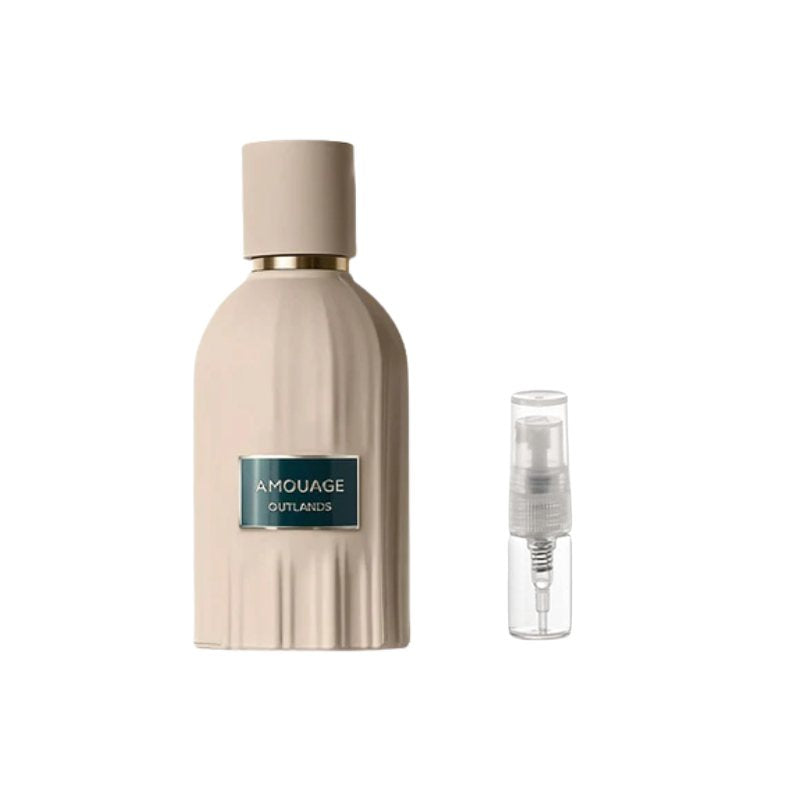 Perfume sample bottle with gold-toned cap, blue label, and small spray vial